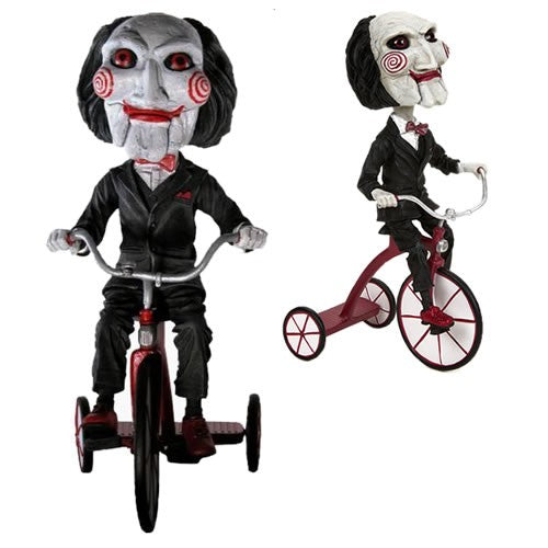 Head Knockers Figures - Saw - Billy The Puppet On Tricycle - NECA